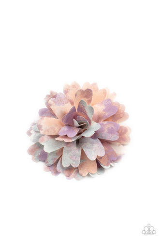 Featuring blue, pink, and purple tie dyed accents, scalloped petals gather in a colorful flower. Features a standard hair clip on the back.