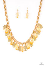 Load image into Gallery viewer, Faceted golden beads and imperfect gold teardrops drip from the bottom of a shimmery gold chain, creating a sassy fringe below the collar. Features an adjustable clasp closure.
