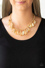 Load image into Gallery viewer, Faceted golden beads and imperfect gold teardrops drip from the bottom of a shimmery gold chain, creating a sassy fringe below the collar. Features an adjustable clasp closure.
