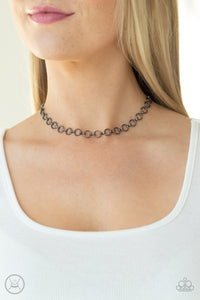 Attached to dainty fittings, a collection of shiny gunmetal links connect around the neck for a minimalist inspired fashion. Features an adjustable clasp closure.  Sold as one individual choker necklace. Includes one pair of matching earrings.  New Kit Choker