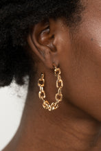 Load image into Gallery viewer, An immovable row of gold chain delicately twists into an edgy hoop for an intense industrial vibe. Earring attaches to a standard post fitting. Hoop measures approximately 1 3/4&quot; in diameter.  Sold as one pair of hoop earrings.
