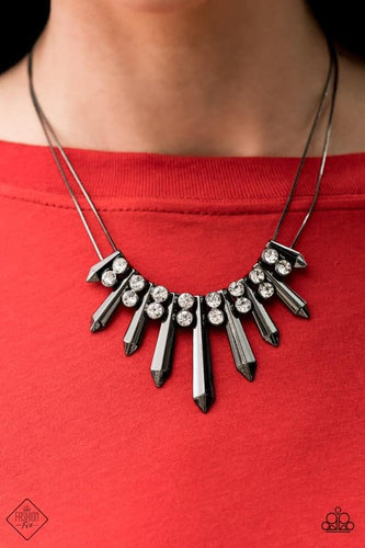 Pairs of glittery white rhinestones alternate between flared gunmetal rods that are threaded along two rows of flat gunmetal chains, creating a dangerously dazzling fringe below the collar. Features an adjustable clasp closure.