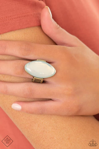 Featuring a dewy iridescence, an oversized white opal bead sits atop a sleek brass frame for an ethereally rustic fashion. Features a stretchy band for a flexible fit.