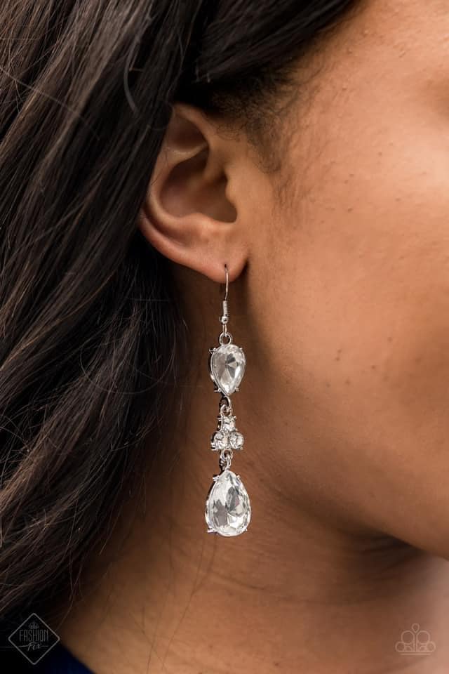 A trio of dazzling white rhinestones unites two white teardrop gems as they dangle brilliantly from the ear for a flawless finish. Earring attaches to a standard fishhook fitting.