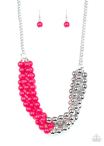 Featuring half silver and half pink beads, a colorful collision of beads layer below the collar for a powerful pop of color. Features an adjustable clasp closure.