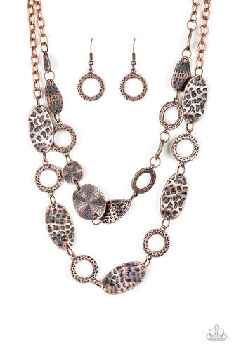 Delicately hammered in shimmery textures, mismatched copper frames link below the collar in two seasonal layers. Features an adjustable clasp closure.