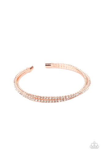 Featuring shiny copper fittings, two rows of glassy white rhinestones delicately twist into a dainty cuff around the wrist.  Sold as one individual bracelet.