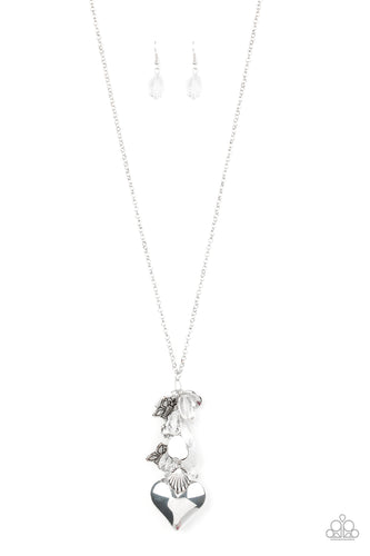 Infused with an array of white beads, a collection of antiqued silver shell and butterfly charms trickle along the bottom of a shimmery silver chain. Complemented with glittery white rhinestone encrusted beads, a dramatically oversized silver heart pendant swings from the bottom of the clustered tassel for a whimsical finish. Features an adjustable clasp closure.