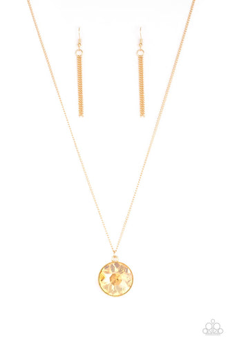 An oversized golden gem swings from the bottom of a lengthened gold chain for a dramatic look. Features an adjustable clasp closure.