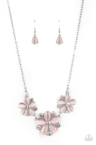 Dotted with glassy white rhinestone centers, a trio of pink cat's eye stone petaled flowers blossom below the collar for an enchanted look. Features an adjustable clasp closure.