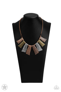 Abstract wavy plates of copper, silver, and brass are texturized with eye-catching hammered divots and alternating copper beads along a copper chain. Features an adjustable clasp closure.  Sold as one individual necklace. Includes one pair of matching earrings. BlockbusterLogo