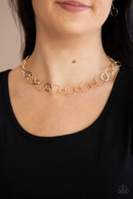 Load image into Gallery viewer, Dainty gold hoops and rings delicately link into a chic chain, creating simplistic shimmer below the collar. Features an adjustable clasp closure.
