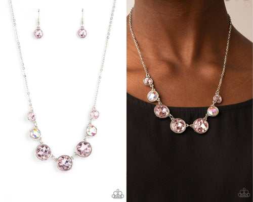 Encased in shiny silver frames, a glitzy collection of pink and iridescent gems gradually increase in size as they link below the collar for a flawless finish. Features an adjustable clasp closure.  Sold as one individual necklace. Includes one pair of matching earrings.