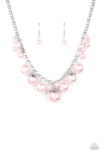 Capped in shiny silver fittings, oversized pearly pink beads and a collection of classic pink pearls swing from the bottom of a shimmery silver chain, creating a bubbly fringe below the collar. Features an adjustable clasp closure