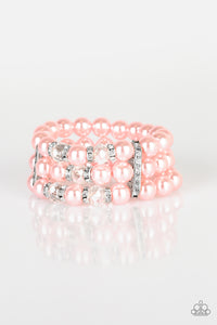 Pinched between white rhinestone encrusted frames, white rhinestone encrusted rings, crystal-beads, and pink pearls are threaded along elastic stretchy bands for a glamorous look.