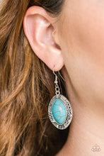 Load image into Gallery viewer, A refreshing turquoise stone is pressed into the center of a glistening silver frame radiating with floral and tribal inspired patterns for a seasonal look. Earring attaches to a standard fishhook fitting.

