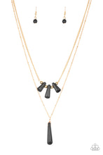 Load image into Gallery viewer, Chiseled into flared teardrop shapes, a dainty fringe of black stones and golden beads gives way to a large stone pendant, creating earthy layers down the chest. Features an adjustable clasp closure.
