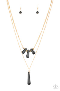 Chiseled into flared teardrop shapes, a dainty fringe of black stones and golden beads gives way to a large stone pendant, creating earthy layers down the chest. Features an adjustable clasp closure.