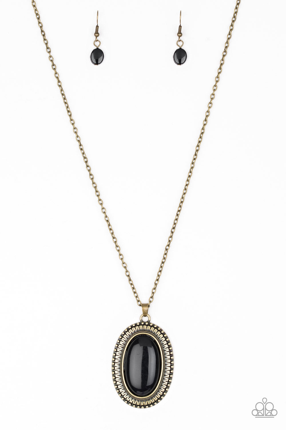 Brushed in a faux rock polish, a shiny black bead is pressed into an ornate brass frame for a seasonal look. Features an adjustable clasp closure.