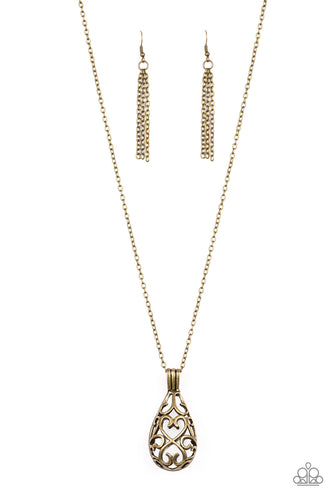 Brushed in an antiqued shimmer, glistening brass filigree joins into an airy 3-dimensional pendant at the bottom of a lengthened brass chain for a whimsical look.