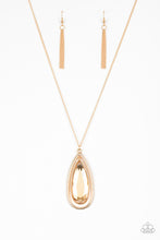 Load image into Gallery viewer, An oversized golden teardrop gem swings from the top of a glistening gold teardrop frame. The dramatic pendant swings from the bottom of an elegantly elongated gold chain for a regal finish
