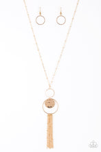 Load image into Gallery viewer, A delicately hammered gold disc is stamped in the inspirational word, &quot;faith&quot; and suspended from a double-hooped pendant at the bottom of an elongated gold satellite chain. A gold tassel swings from the bottom of the shimmery palette for a whimsical finish. Features an adjustable clasp closure.
