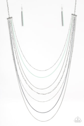 Mismatched silver chains alternate with dainty gray and green chains down the chest, creating a colorful industrial look. Features an adjustable clasp closure.