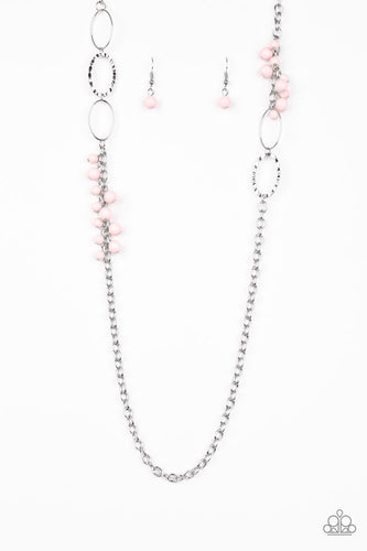 Smooth and hammered silver rings join clusters of shiny pink beads along a shimmery silver chain for a colorful look. Features an adjustable clasp closure.