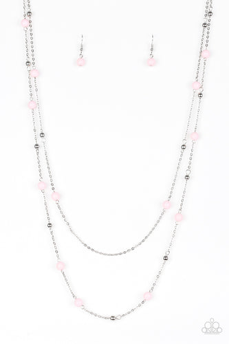 Pretty pink and dainty silver beads trickle along two shimmery silver chains, creating colorful layers down the chest. Features an adjustable clasp closure