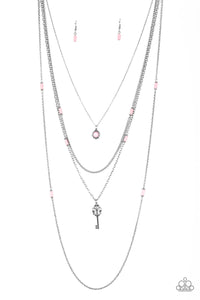 Featuring flirty pink and dainty silver accents, a pink beaded pendant gives way to a shimmery silver key for a whimsically layered look. Features an adjustable clasp closure.