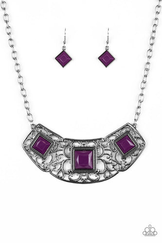 Glistening silver filigree spins into a dramatic pendant below the collar. Square plum beads are pressed into the airy frame for a colorful finish. Features an adjustable clasp closure.