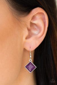 Glistening silver filigree spins into a dramatic pendant below the collar. Square plum beads are pressed into the airy frame for a colorful finish. Features an adjustable clasp closure.