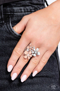 Two flowers in complementary shades of coral are paired with a silver flower in a sleek finish.  Each flower is dotted with brilliant white rhinestones for flawless light-catching detail. Features a stretchy band for a flexible fit.