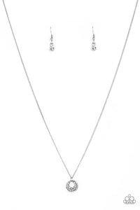 Encrusted in glittery white rhinestones, a dainty silver pendant swings below the collar for a glamorous look. Features an adjustable clasp closure