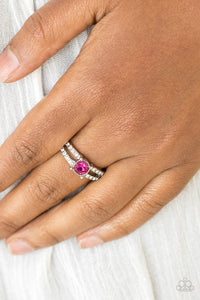 A glittery pink rhinestone sits atop two shimmery silver bands encrusted in glassy white rhinestones for a glamorous look. Features a dainty stretchy band for a flexible fit.