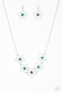 Dotted with radiant blue rhinestone centers, airy silver flowers link below the collar for a seasonal look. Features an adjustable clasp closure.