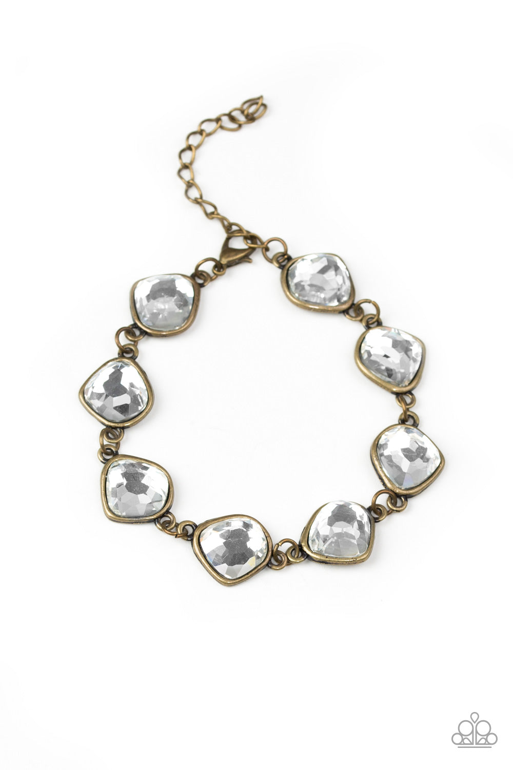 Featuring antiqued brass frames, imperfect glassy white gems link around the wrist for a glamorous vintage inspired look. Features an adjustable clasp closure.