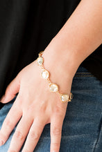 Load image into Gallery viewer, Featuring shimmery gold frames, imperfect golden gems link around the wrist for a glamorous vintage inspired look. Features an adjustable clasp closure.
