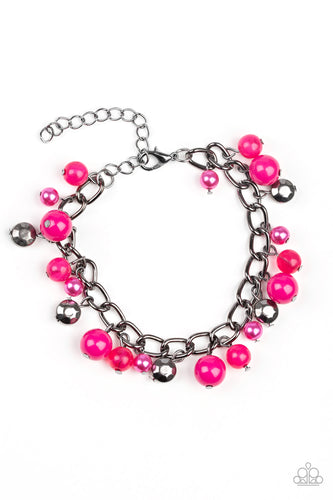 Pearly and polished pink beading joins faceted gunmetal beads along a bold gunmetal chain, creating a sassy fringe around the wrist. Features an adjustable clasp closure.