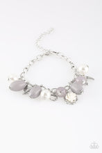 Load image into Gallery viewer, Gorgeous pearls, luminescent gray beading, and a collection of shiny silver charms, including a bird and a feather, dance around the wrist in a whimsical fashion. Features an adjustable clasp closure.

