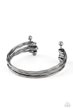 Load image into Gallery viewer, Delicately hammered in sections of shimmer, glistening gunmetal bars are threaded along two metallic rods, creating a layered cuff across the wrist.
