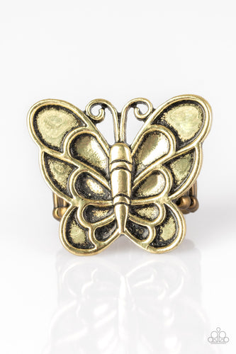 Brushed in an antiqued finish, a dramatic brass butterfly blooms across the finger for a whimsical look. Features a stretchy band for a flexible fit.