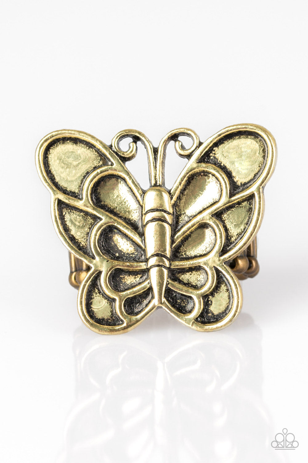 Brushed in an antiqued finish, a dramatic brass butterfly blooms across the finger for a whimsical look. Features a stretchy band for a flexible fit.