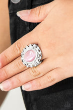 Load image into Gallery viewer, Encrusted in dainty white rhinestones, a frilly silver frame spins around a glowing pink moonstone center for a regal look. Features a stretchy band for a flexible fit.
