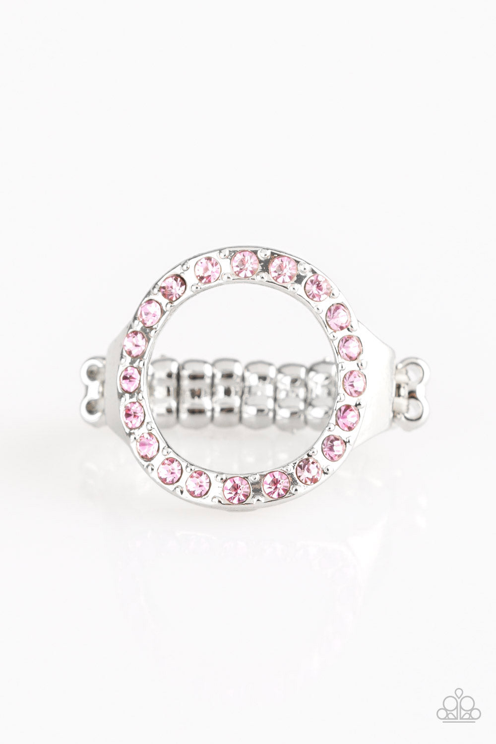 Encrusted in glittery pink rhinestones, a circular frame adorns the finger, creating a glamorous centerpiece. Features a stretchy band for a flexible fit.