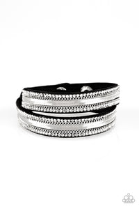 Rows of classic silver chain, flat silver chain, and dainty white rhinestones are encrusted along a black suede band for a sassy look. The elongated band allows for a trendy double wrap design. Features an adjustable snap closure.