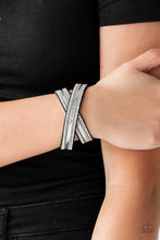 Load image into Gallery viewer, Rows of classic silver chain, flat silver chain, and dainty white rhinestones are encrusted along a black suede band for a sassy look. The elongated band allows for a trendy double wrap design. Features an adjustable snap closure.
