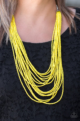 Infused with two bold silver fittings, row after row of sunny yellow seed beads layer across the chest for a seasonal fashion. Features an adjustable clasp closure.  Sold as one individual necklace. Includes one pair of matching earrings.