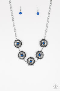 Infused with bright blue beaded centers, ornate floral stamped frames link below the collar for a colorfully, seasonal look. Features an adjustable clasp closure.