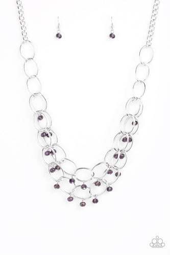 Metallic purple crystal-like beads swing from two layers of oversized silver links below the collar for a refined look. Features an adjustable clasp closure.